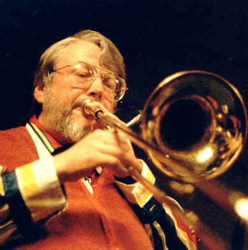Man In Glasses Playing The Trombone